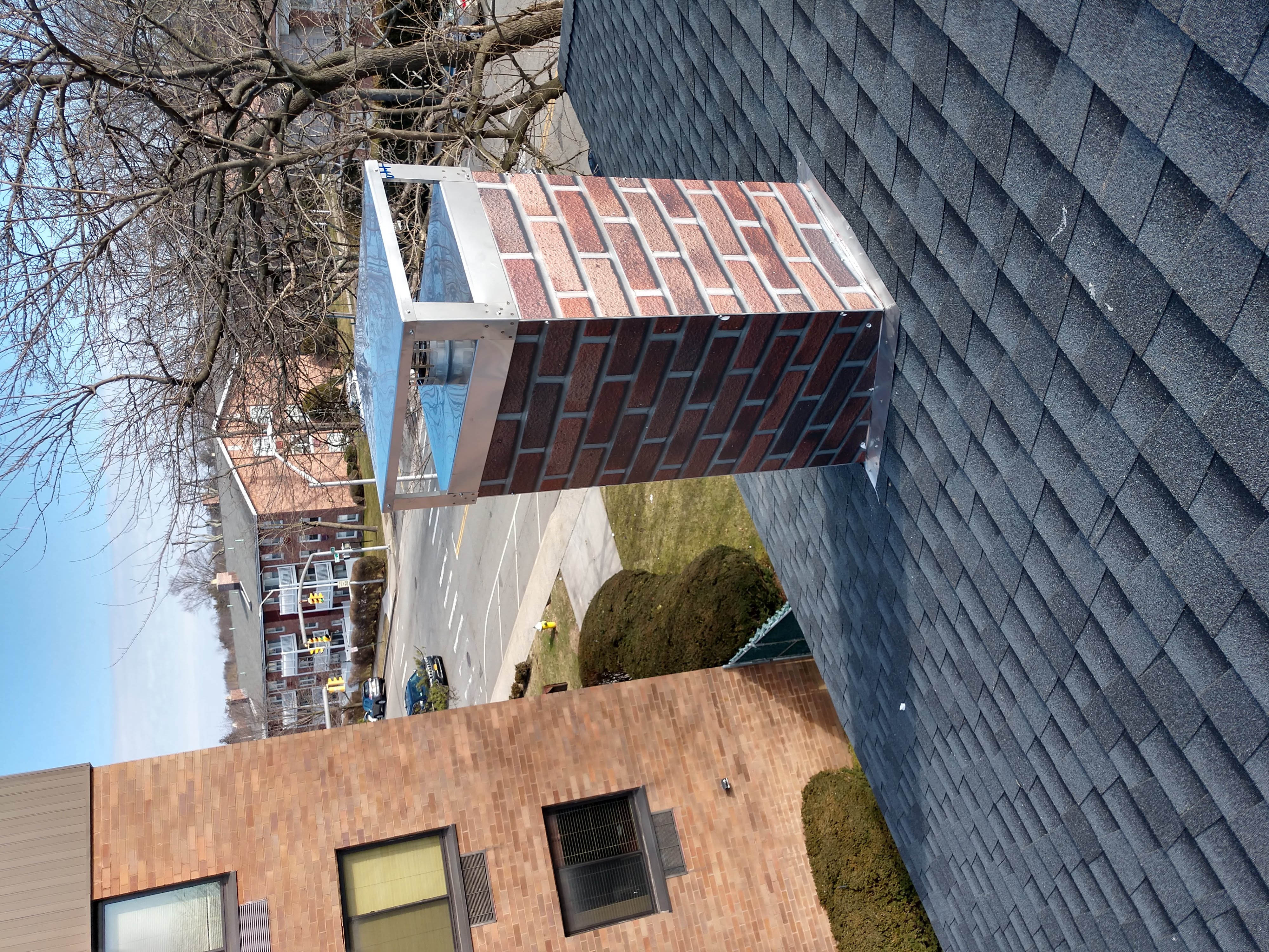 New elastomeric sealant applied to chimney crown in Merrick, NY