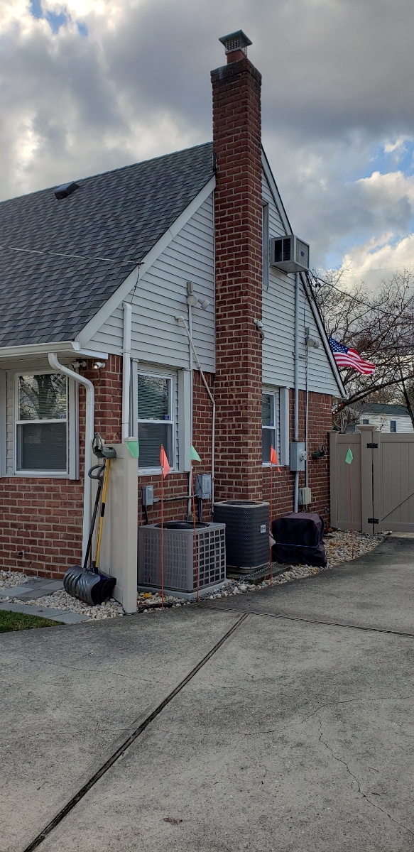 Professional chimney repointing restoring brick joints in Merrick, NY