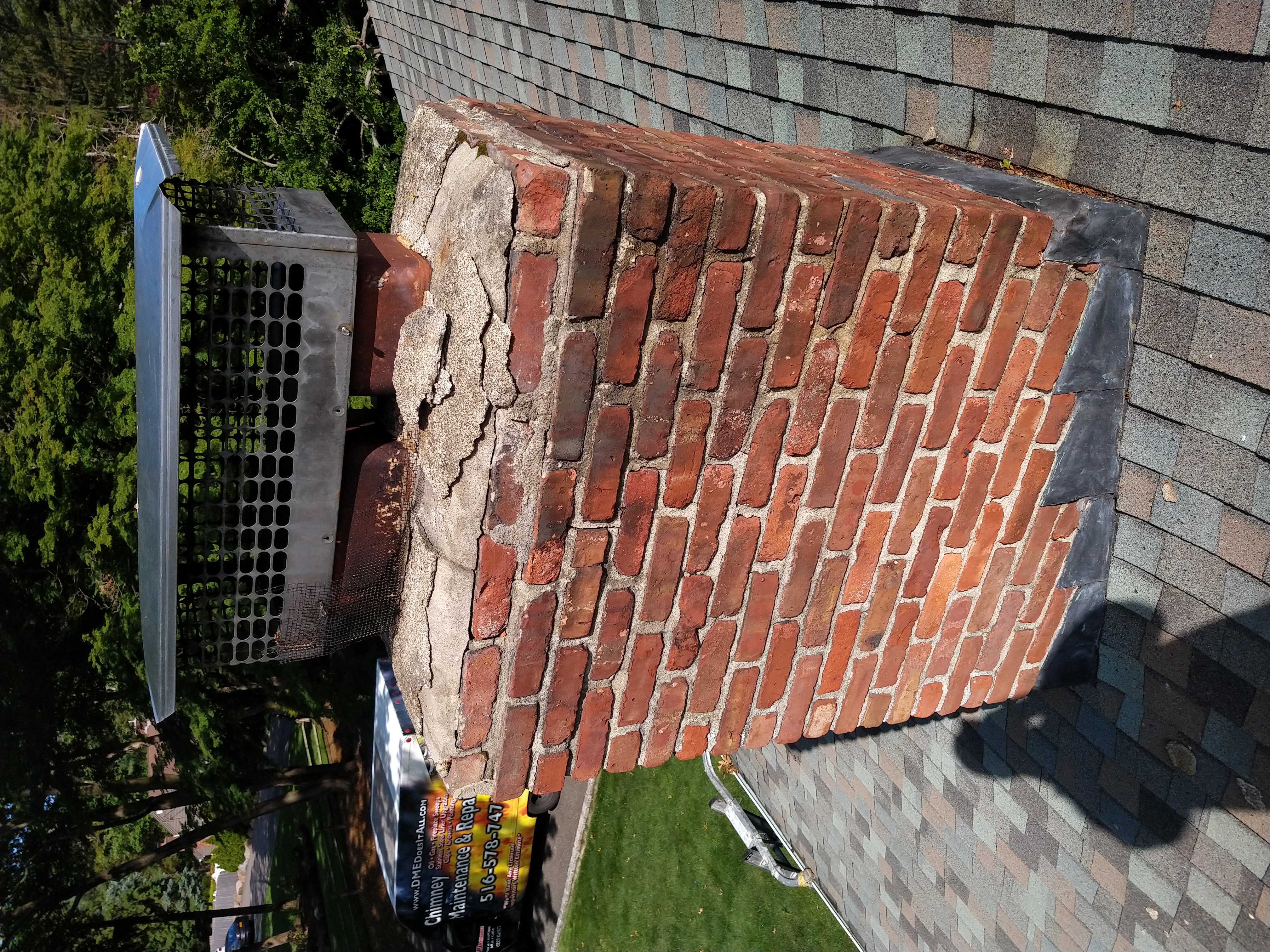 Cracked chimney crown professionally repaired in Merrick, New York